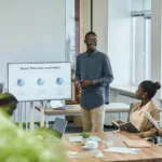 Tim profesional dalam rapat bisnis dengan presentasi penjualan di kantor modern